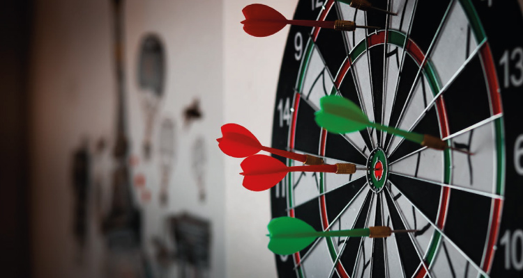 photo of a dartboard, depicting the importance of writing content that speaks directly to your target audience