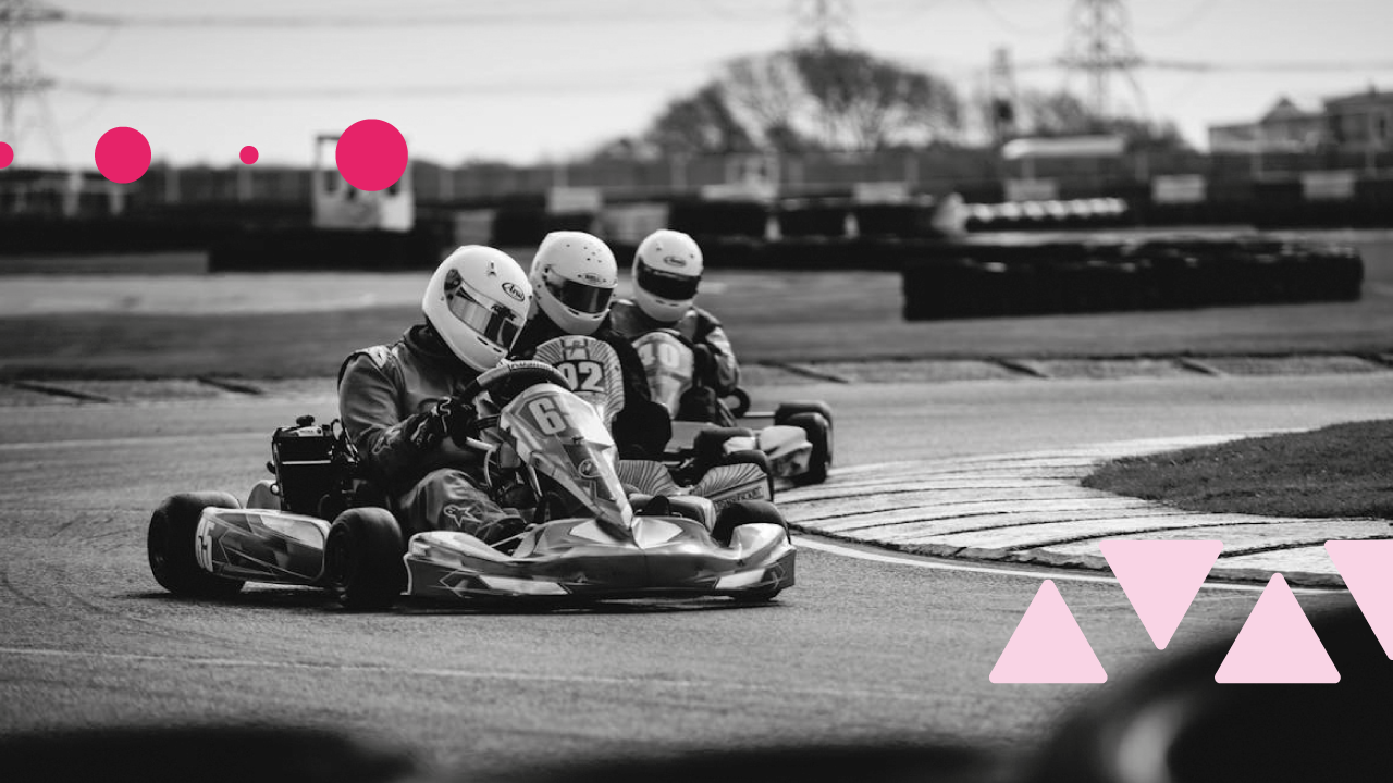 photo of go karts racing each other, depicting a competition, as this blog looks at no code web design platforms vs wordpress