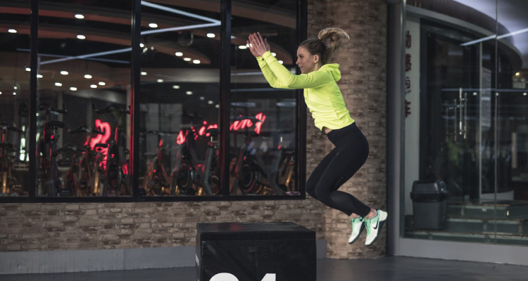 photo of a girl doing a workout, depicting action content as one of the types of web content